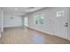 Bright living room features wood-look flooring, recessed lighting and large windows at 3231 Stonehaven Dr, North Charleston, SC 29420