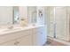 Bright bathroom with double vanity, a decorative mirror feature, and glass shower at 325 Willow Run Dr, Summerville, SC 29486