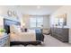 Comfortable bedroom featuring neutral tones, large window, and a well-coordinated decor at 325 Willow Run Dr, Summerville, SC 29486