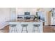 Kitchen island with granite countertops, seating for three, and stainless steel appliances at 325 Willow Run Dr, Summerville, SC 29486