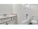 Clean bathroom featuring a tub and shower combination, white tile, and a vanity with stone countertops at 327 Megans Bay Ln, Charleston, SC 29492
