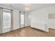 Bright bedroom with natural light, hardwood floors, modern cabinet and light fixtures for a cozy feel at 327 Megans Bay Ln, Charleston, SC 29492