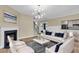 Inviting living room with fireplace, stylish furniture, and modern lighting, perfect for relaxation at 327 Megans Bay Ln, Charleston, SC 29492