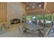 Pool pavilion features a brick fireplace and seating area overlooking pool and umbrellas at 327 Megans Bay Ln, Charleston, SC 29492