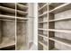 Spacious walk-in closet with custom shelving, providing ample storage and organization options at 327 Megans Bay Ln, Charleston, SC 29492