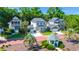An aerial view of a neighborhood showcasing beautiful homes and lush greenery at 3285 Johnstowne St, Johns Island, SC 29455