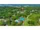 Aerial view of a community featuring a pool, tennis courts, and golf course near the water at 3285 Johnstowne St, Johns Island, SC 29455