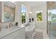 Beautiful bathroom with a soaking tub, dual vanities, and stylish tile work at 3285 Johnstowne St, Johns Island, SC 29455