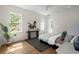 Bright bedroom with hardwood floors, modern decor, and large windows offering plenty of natural light at 3285 Johnstowne St, Johns Island, SC 29455