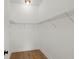 Walk-in closet with open shelving and hardwood floors at 3285 Johnstowne St, Johns Island, SC 29455