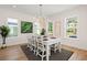 Bright dining room featuring white table, chairs, and windows at 3285 Johnstowne St, Johns Island, SC 29455