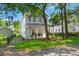 Charming two-story home surrounded by mature trees and lush landscaping at 3285 Johnstowne St, Johns Island, SC 29455