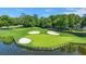 Scenic view of a lush golf course with water feature and sand traps, perfect for golf enthusiasts at 3285 Johnstowne St, Johns Island, SC 29455