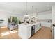 Gourmet kitchen island with modern lighting and stainless steel appliances, open to the living room at 3285 Johnstowne St, Johns Island, SC 29455