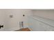 Bright laundry room with white cabinets, marble countertops, gold hardware, and washer/dryer hookups at 3285 Johnstowne St, Johns Island, SC 29455