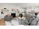 Spacious living room featuring a fireplace, modern furniture, and open to kitchen at 3285 Johnstowne St, Johns Island, SC 29455
