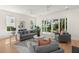 Bright and airy living room with sliding glass doors and contemporary decor at 3285 Johnstowne St, Johns Island, SC 29455