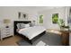 Bright and airy main bedroom with natural light, a plush bed, and modern decor at 3285 Johnstowne St, Johns Island, SC 29455
