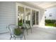 Covered patio with comfortable seating, perfect for relaxing and enjoying the outdoors at 3285 Johnstowne St, Johns Island, SC 29455