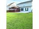 Spacious backyard with a screened-in porch and lush green lawn at 332 Southern Sugar Ave, Moncks Corner, SC 29461