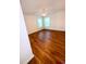 Bright bedroom featuring hardwood floors, two windows, and a ceiling fan at 332 Southern Sugar Ave, Moncks Corner, SC 29461