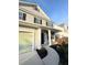 Charming two-story home with a well-manicured lawn, inviting front porch, and attached garage at 332 Southern Sugar Ave, Moncks Corner, SC 29461