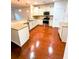 Spacious kitchen features a breakfast bar, white cabinetry, granite countertops, and stainless appliances at 332 Southern Sugar Ave, Moncks Corner, SC 29461