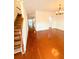 Inviting living room with gleaming hardwood floors, crown molding, and lots of natural light at 332 Southern Sugar Ave, Moncks Corner, SC 29461
