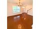 Open-concept living area with hardwood floors, modern lighting, and sliding glass doors at 332 Southern Sugar Ave, Moncks Corner, SC 29461