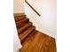 Staircase with hardwood steps and landing featuring white trim and baseboards at 332 Southern Sugar Ave, Moncks Corner, SC 29461