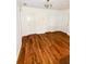 Wood floors, white trim, and doors at upstairs landing with ceiling fan at 332 Southern Sugar Ave, Moncks Corner, SC 29461