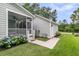 Backyard with a partial view of a screened-in porch with a cement walkway at 3408 Salterbeck St, Mount Pleasant, SC 29466