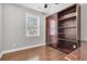 Bedroom with a light grey wall, hardwood flooring and a built in cabinet at 3408 Salterbeck St, Mount Pleasant, SC 29466