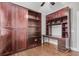 Bedroom with built-in wooden cabinets, shelves and a desk at 3408 Salterbeck St, Mount Pleasant, SC 29466