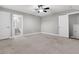 Bedroom features neutral carpet, natural lighting, and an attached bathroom at 3408 Salterbeck St, Mount Pleasant, SC 29466