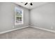 Bedroom features neutral carpet, natural lighting, and a ceiling fan at 3408 Salterbeck St, Mount Pleasant, SC 29466