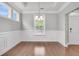 Formal dining room featuring classic wainscoting and natural light at 3408 Salterbeck St, Mount Pleasant, SC 29466