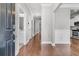 Entryway with wood floors, gray walls and a view to the kitchen at 3408 Salterbeck St, Mount Pleasant, SC 29466