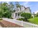 Beautiful home with a white picket fence and lush green lawn at 3408 Salterbeck St, Mount Pleasant, SC 29466