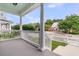 Inviting front porch with white railings and gray flooring at 3408 Salterbeck St, Mount Pleasant, SC 29466