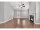Open-concept living room featuring wood floors, fireplace, and access to the backyard at 3408 Salterbeck St, Mount Pleasant, SC 29466