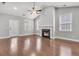 Bright living room with a fireplace, wood floors, and natural light at 3408 Salterbeck St, Mount Pleasant, SC 29466