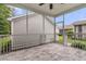 Screened in porch featuring white railing, gray tile floor, ceiling fan and view of the back yard at 3408 Salterbeck St, Mount Pleasant, SC 29466