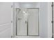 Glass shower with a bench, hand shower and neutral walls at 3408 Salterbeck St, Mount Pleasant, SC 29466