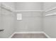 Walk-in closet offers ample storage space with shelves and neutral carpet floors at 3408 Salterbeck St, Mount Pleasant, SC 29466