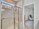 Modern bathroom featuring a glass-enclosed shower with seating, and neutral tile at 350 Dahlia Row Dr, Summerville, SC 29486