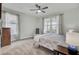 Serene bedroom featuring a plush bed, soft carpet, and ample natural light at 350 Dahlia Row Dr, Summerville, SC 29486