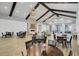 Charming clubhouse featuring round tables, fireplace, and abundant natural light, creating a welcoming atmosphere for residents at 350 Dahlia Row Dr, Summerville, SC 29486