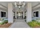 Welcoming clubhouse entrance with manicured landscaping and modern lighting at 350 Dahlia Row Dr, Summerville, SC 29486