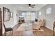 Cozy living room with plush seating, ceiling fan, and decorative furnishings at 350 Dahlia Row Dr, Summerville, SC 29486